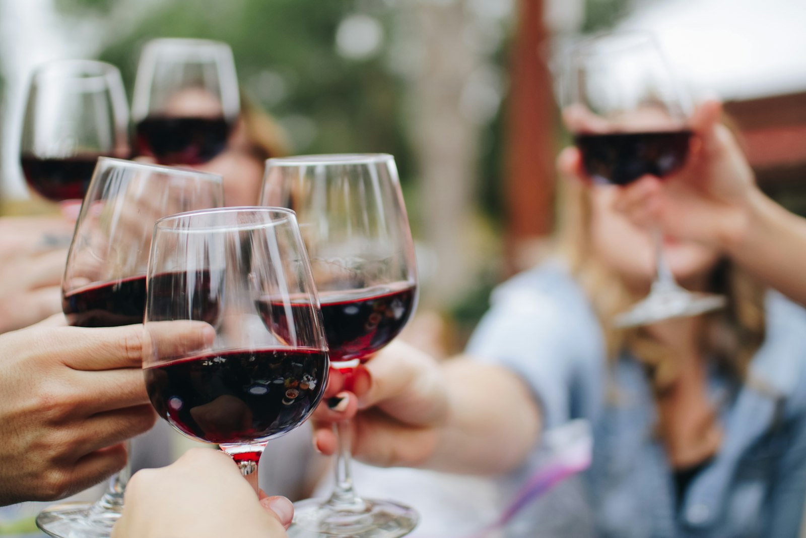 Wine being poured into a glass at an event